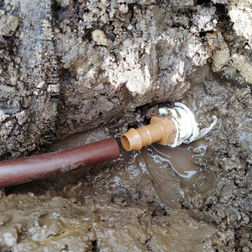 Pushing drip tubing onto a male adapter