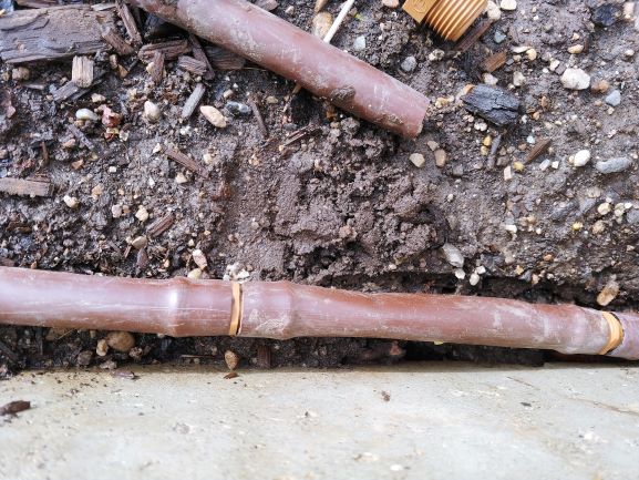 Drip line repaired with barbed couplings