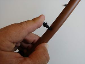Demonstrating how to insert a drip line puncture connector