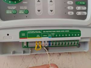 Detailed view of wiring a new sprinkler timer