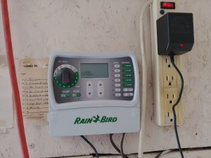 Step-by-step process of mounting a new sprinkler timer